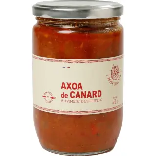 Axoa de Canard 600g : Recette traditionnelle basque, canard tendre cuit avec herbes et piment d'Espelette. Un délice pour les amateurs de cuisine du sud-ouest. Bocal 600g.